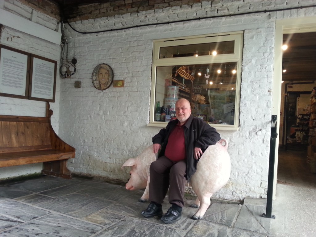 Fr. David sitting on a pig-chair.